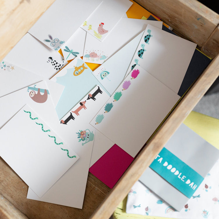 cute notecards in a drawer with fun animal designs for children